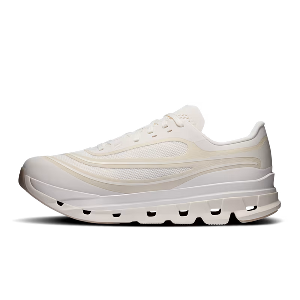 A single low-top sneaker shown in a side profile on a clean white background. The shoe features a chunky, sculpted sole with multiple cutouts, a thick white midsole, and a mesh and synthetic upper in off-white and cream tones.