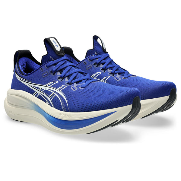 Blue running shoes with white soles on a white background