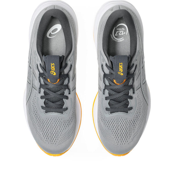 Top down look at a pair of Cumulus 28 running shoes with yellow accents on a white background.