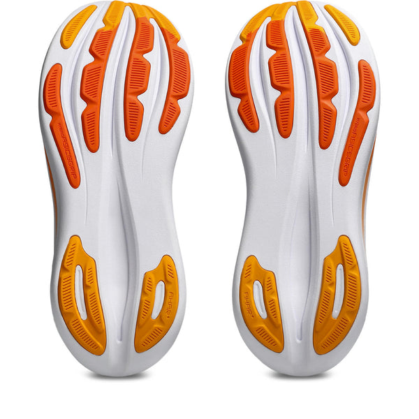White and orange shoe soles on a white background
