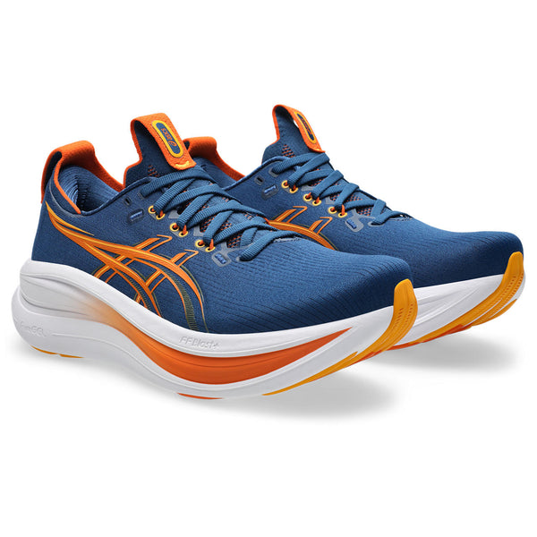 Blue and orange running shoes on a white background