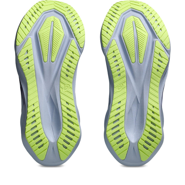 Close-up of a pair of gray and green athletic shoes on a white background