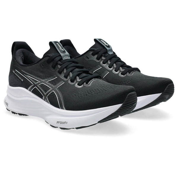 A pair of Women's Kayano 32 running shoes with black laces.