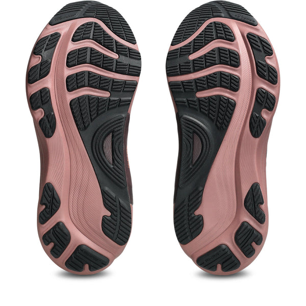 Close-up of pink athletic shoes with black sole pattern to good foot strike.