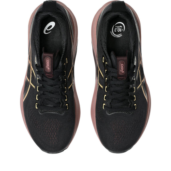 Black running shoes with gold accents on a white background.