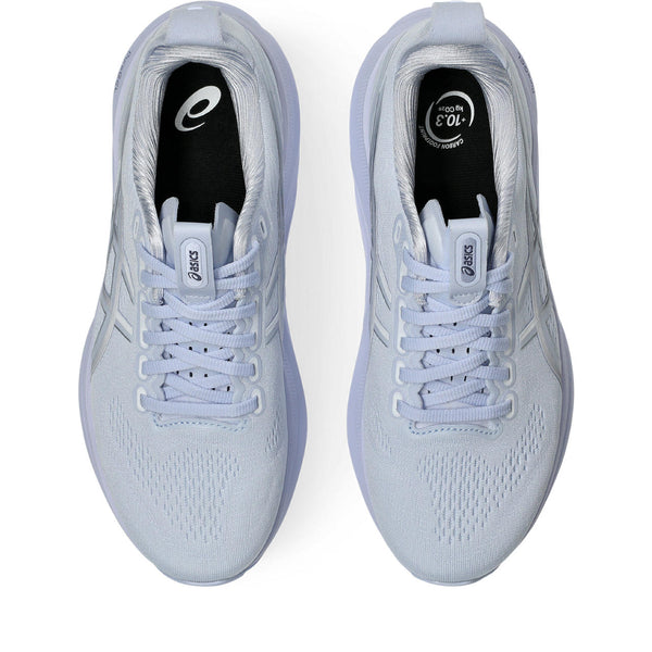 Pair of a tonal Kayano 32 light blue running shoes with white laces on a white background.