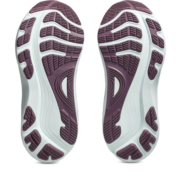 Close-up of a pair of shoes with purple soles on a white background