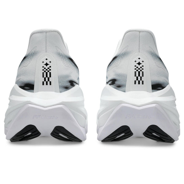 Back view of white running shoes with black sole on a white background