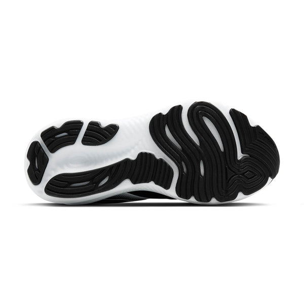 A black rubber pattern on the bottom of the shoe stands out against the white midsole.