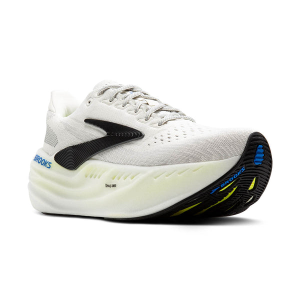 The outsole of this cushioned Brooks shoe is mostly black with pops of blue and yellow.