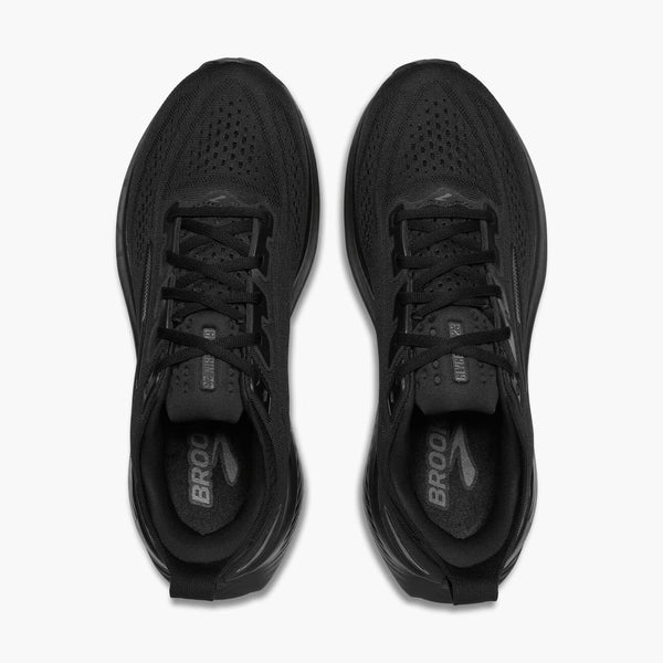 Black running shoes with 'Brooks' branding on a white background