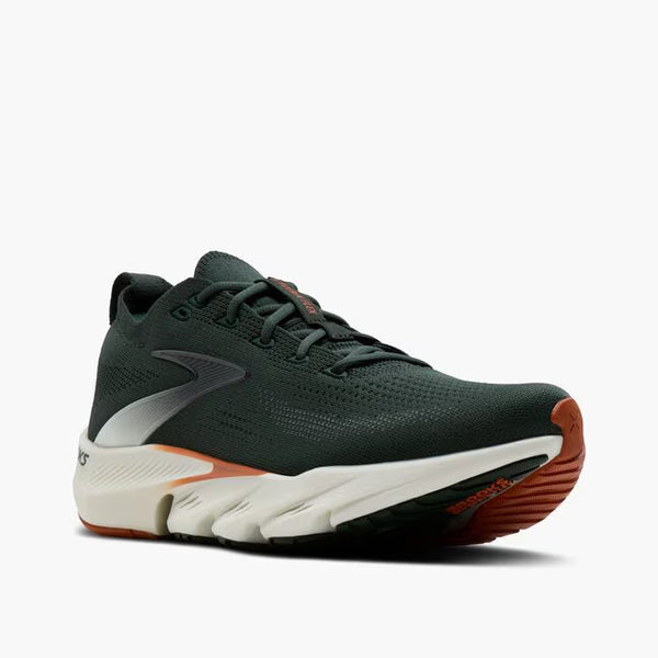 A dark green running shoe with a white midsole and orange outsole accents, shown on a light gray background.