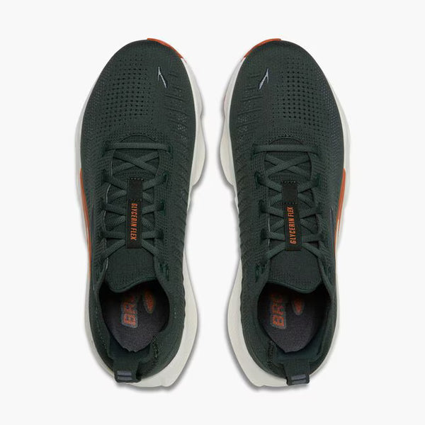 A dark green running shoe with a white midsole and orange outsole accents, shown on a light gray background.