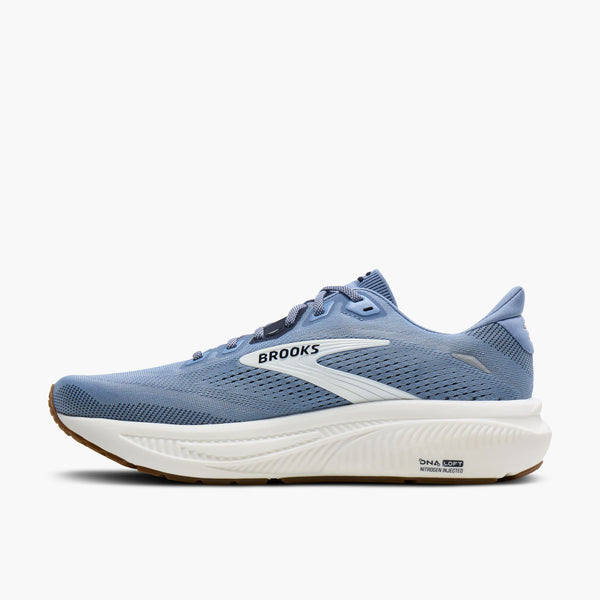 A light blue Brooks running shoe with a thick white midsole and a small brown outsole edge, shown from the side on a light gray background.
