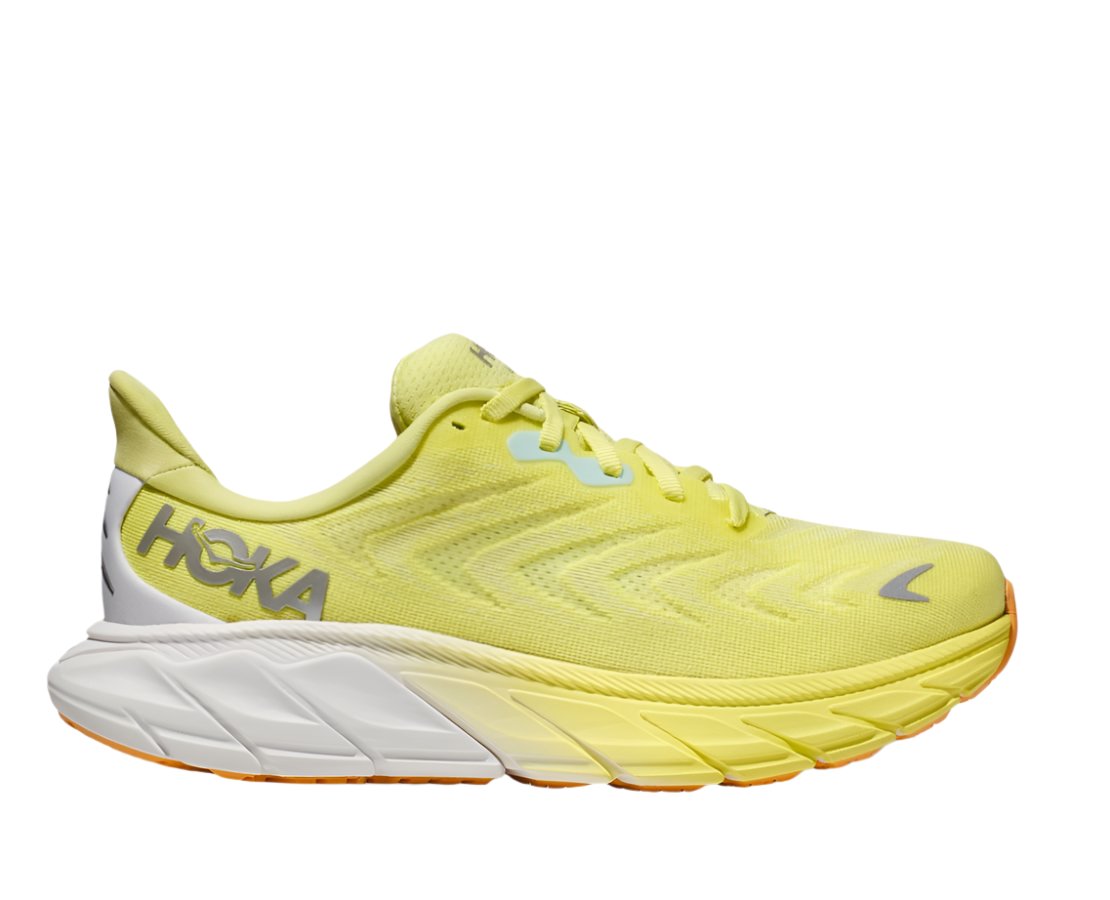 Lateral view of the Women's Arahi 6 by HOKA in the color Citrus Glow/White