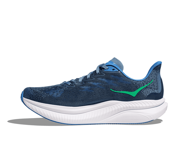The medial side of this Hoka Mach 6 running shoe has a green logo just below the ankle bone.
