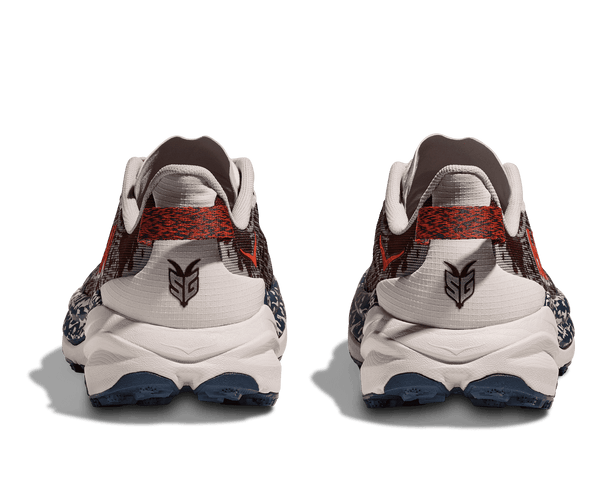 A heathered black and red pull tab is on the heel of this shoe.