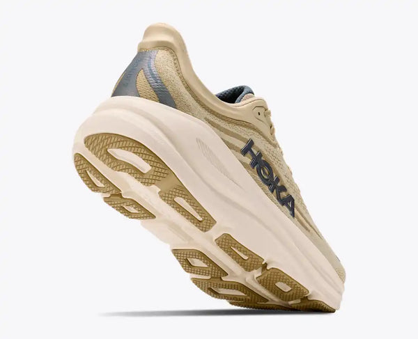 Cream and off-white running shoe on a white background