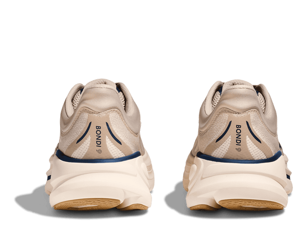 Pair of beige running shoes with 'Bion' branding on a transparent background