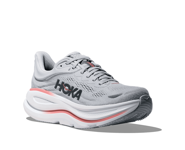Gray running shoe with red accents on a transparent background