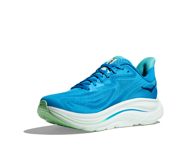 The Hoka logo is stitched near the ankle on the medial side of the upper in navy thread.