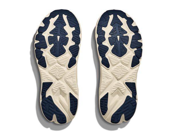 Navy blue rubber is used on the outsole of this shoe to contrast the cream midsole.