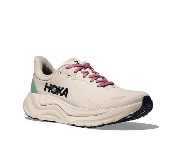 White running shoe with purple laces and 'Hoka' branding on a transparent background