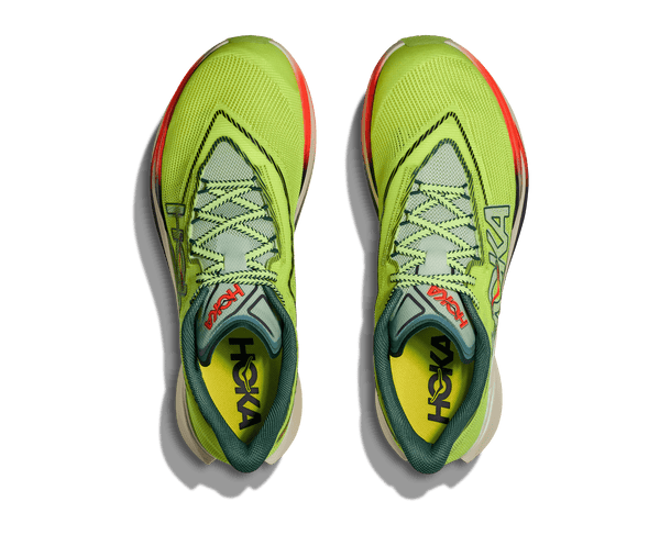 Pair of green running shoes with 'Hoka' branding on a transparent background