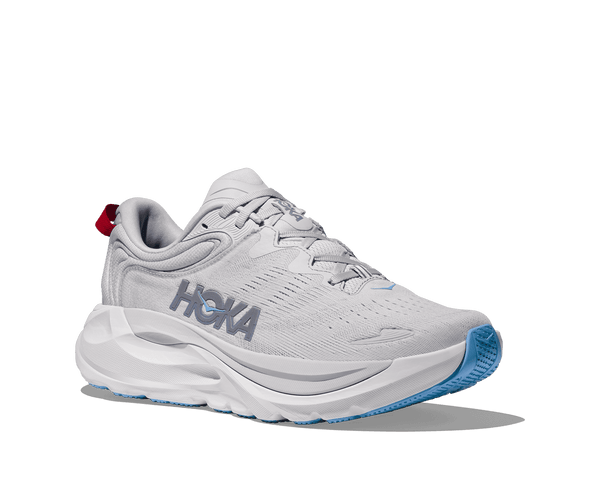 White running shoe with blue sole on a transparent background