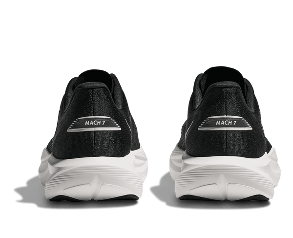 Black running shoes with 'MACH 7' label on a transparent background