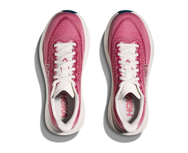 Pink running shoes with white soles on a white background