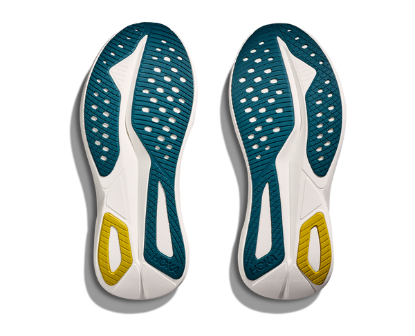 Pair of shoes with blue and yellow soles on a white background