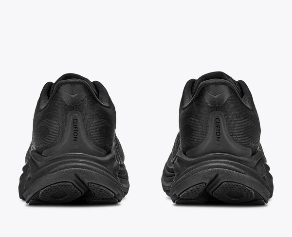 Black running shoe with Hoka branding on a white background