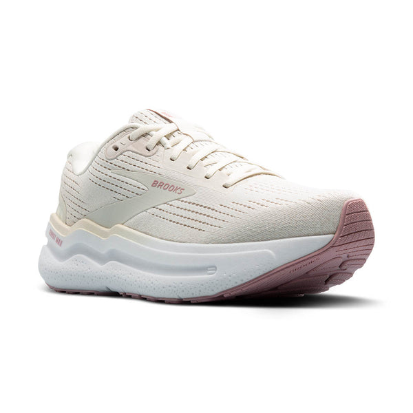 White and pink sneaker with 'Brooks' branding on a white background.