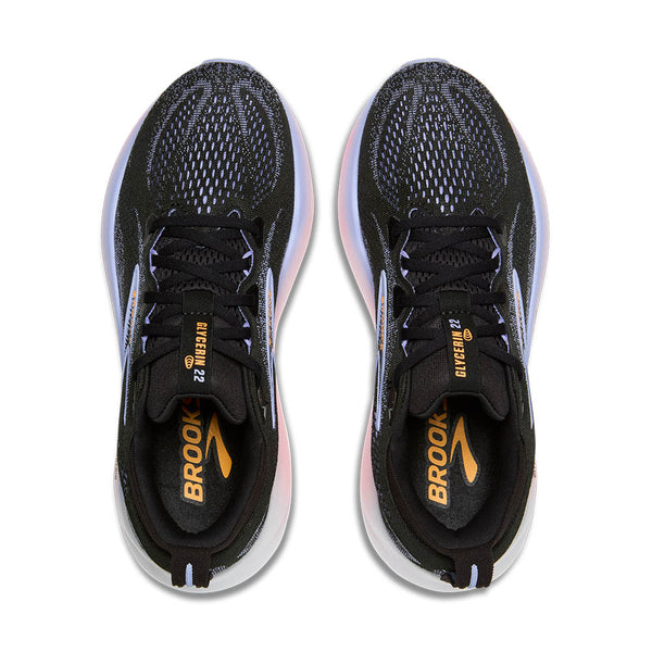 A birds-eye view of this shoe shoes a purple upper poking through black mesh on the toe box.