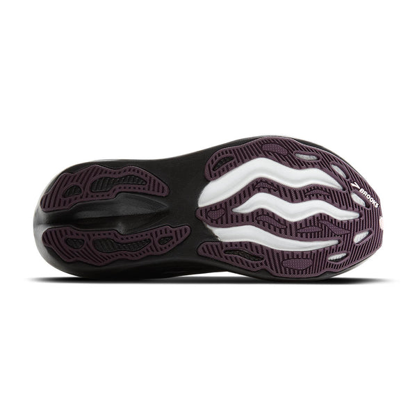 Deep purple rubber pops against the black and white bottom of the shoe.