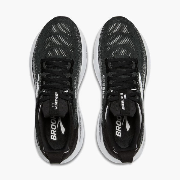 Black running shoes with white soles on a white background