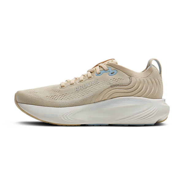 Beige running shoe with white sole on a white background