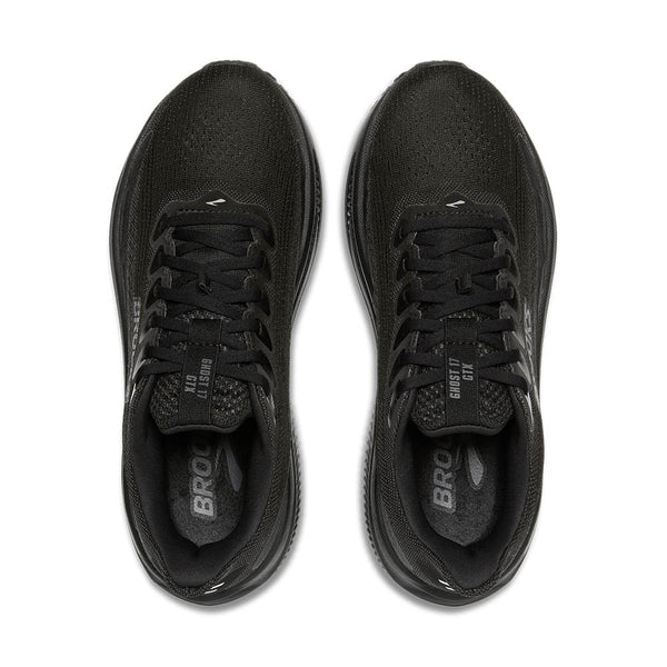 Black running shoes with visible branding on a white background