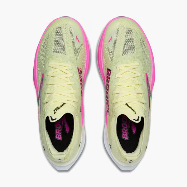 Light yellow and pink running shoe with 'Brooks' branding on a white background