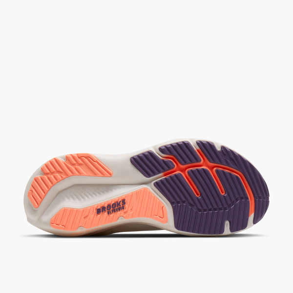 Sole of a running shoe with orange and purple accents on a white background