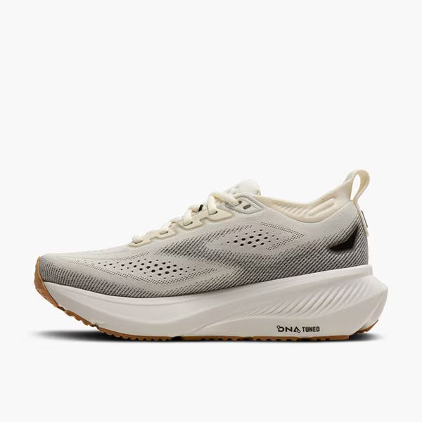 White running shoe with black accents on a white background