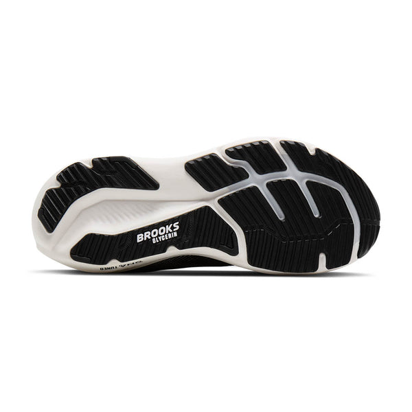 Black and white running shoe with 'Brooks' branding on a white background