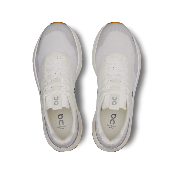 White athletic shoe with visible brand logo on a white background