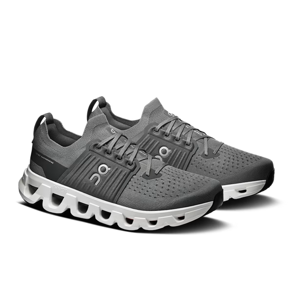 A gray On running shoe with a chunky white and gray CloudTec sole, shown on a white background.
