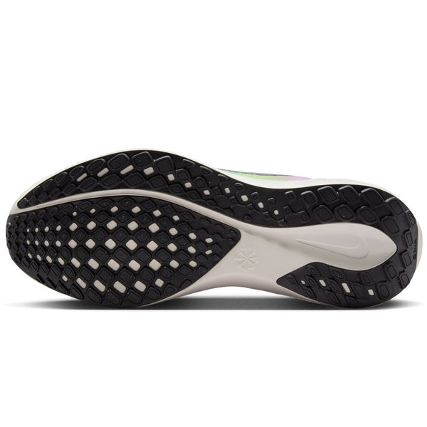 Close-up of a black and white athletic shoe sole on a white background.