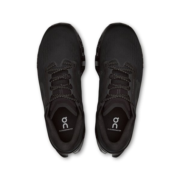 Black running shoes with brand logo on a white background