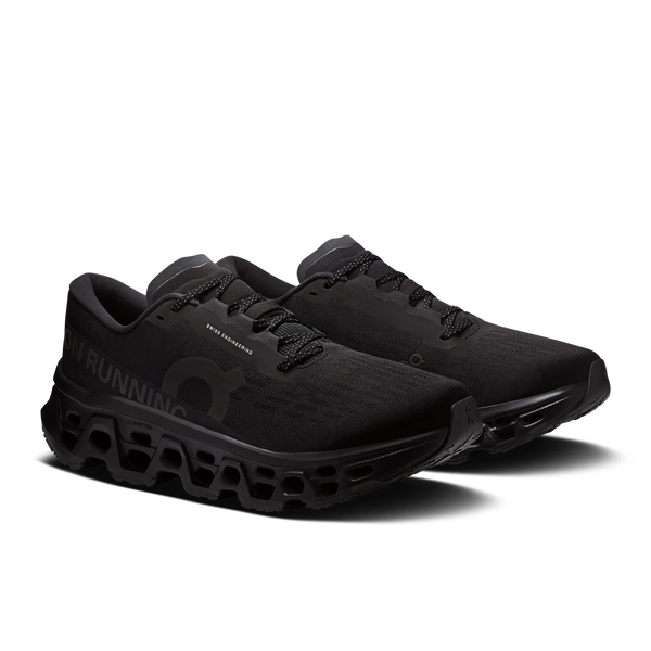 Black running shoes with unique sole design on a white background