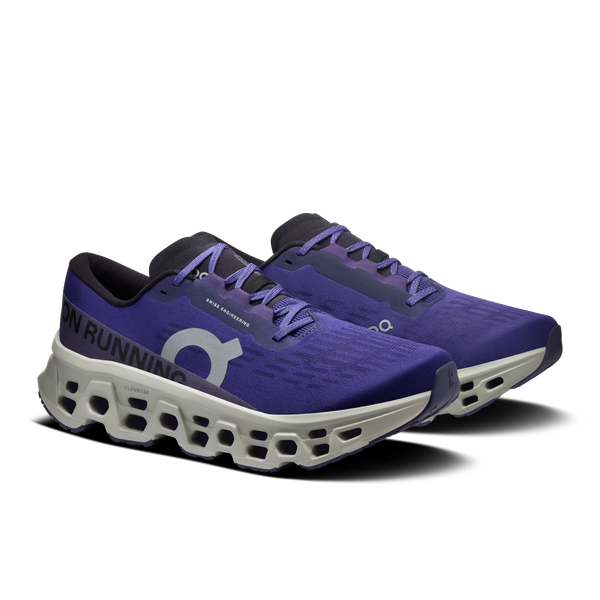 Purple running shoes with white sole on a white background