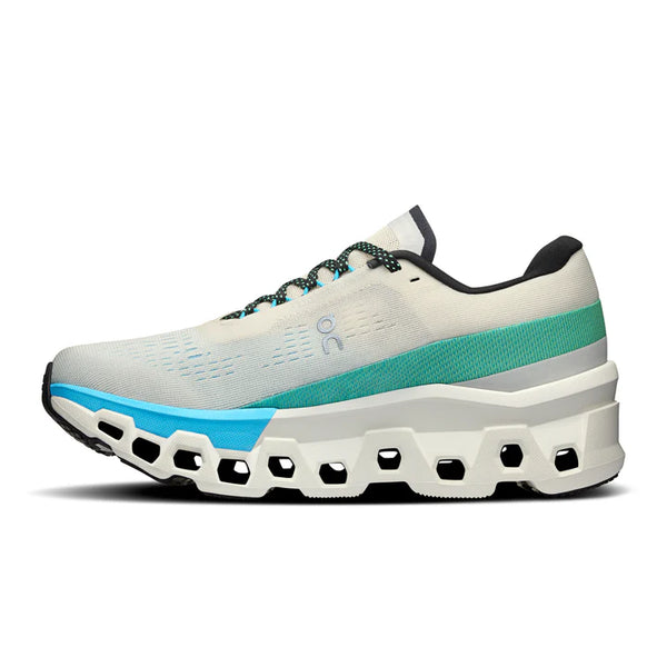 The medial side of a white, blue and teal running shoe with teal accent on a white background.